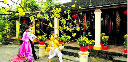 Vietnamese people decorate their houses to celebrate the Lunar New Year